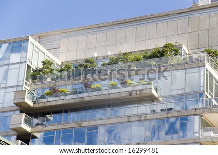 A skyscraper with a green roof promoting environmental sustainability.