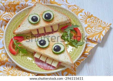 Funny sandwich for kids lunch on a table