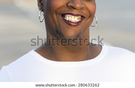 close-up of mouth with gold tooth of an african-american woman