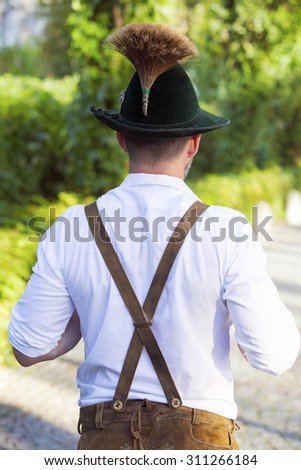 backside of a man in traditional bavarian clothes