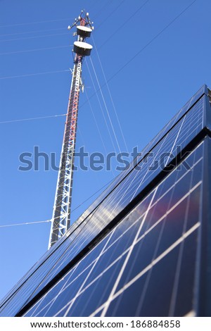 Guyed Cell Tower with solar panels installed on the ground