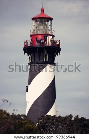 ST. AUGUSTINE, FL - DECEMBER 30: Tourists visiting Lighthouse on Anastasia Island in St. Augustine, Florida during winter day of December 30, 2011. It was built in 1824 and presently is a museum.
