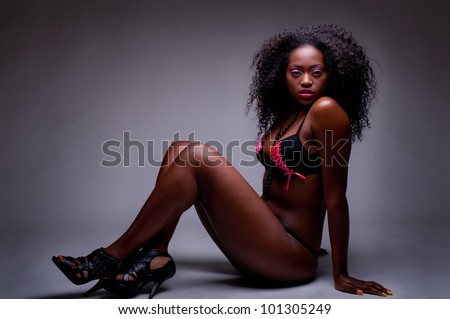 beautiful low key portrait of beautiful black woman in lingerie
