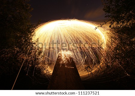 firework / wire wool on fire at night on a jetty