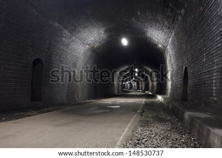 dark tunnel with lights