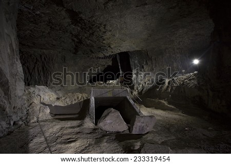 underground cave in torchlight with old mine works