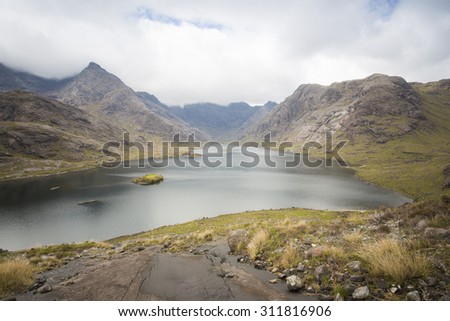 remote mountain range and large lake on isle of skye, Scotland
