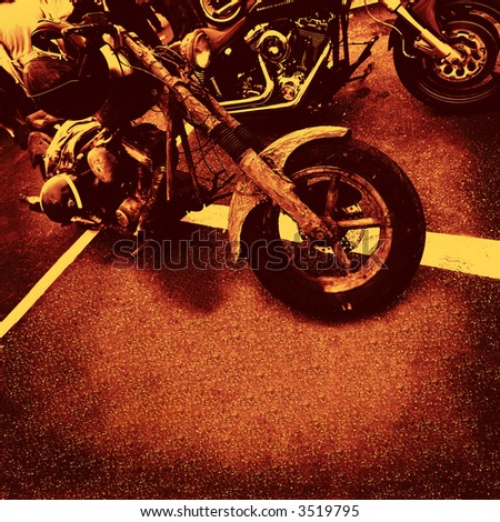 motorbikes in orange brown sienna color on asphalt to use as background or cd cover