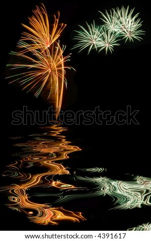 abstract colorful fireworks isolated on black for a postcard of happy new year 2008 with water reflection