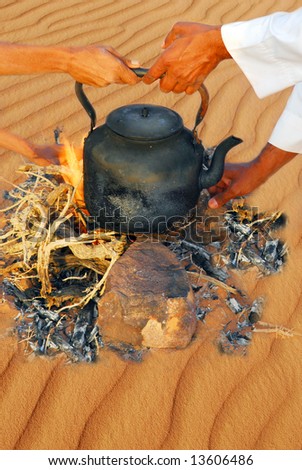 Outdoor cooking with a black kettle on a campfire in Wadi Rum desert, Jordan