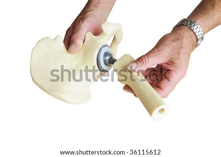 Male surgeon explaining hip replacement to patient by showing the titanium joint, isolated on white background