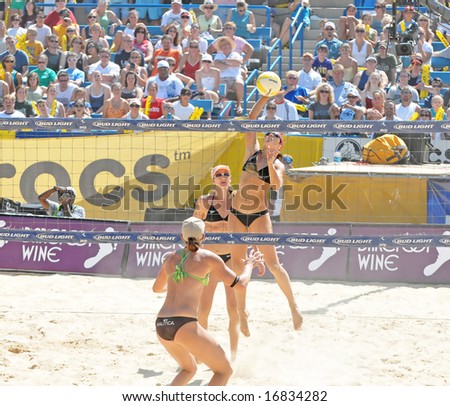 August 31st, 2008--Mason, Ohio.  Kerri Walsh spikes ball  during the finals of an AVP tournament vs. Elaine Youngs and Nicole Branagh.  Walsh was defeated for the first time in over a year