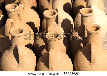 Clay pot of manual work. It is possible to store milk or other liquid