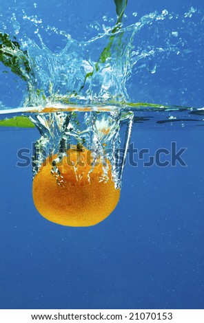 A series, fruit in water on a dark blue background