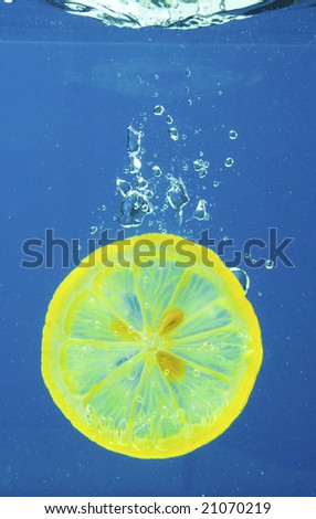 A series, fruit in water on a dark blue background