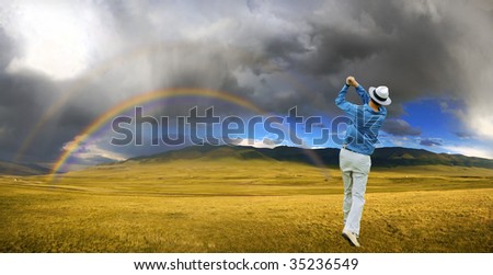 Game in the golf. Rainbow after the storm