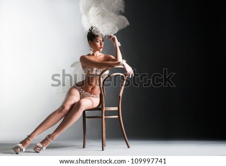 Seductive dancer sitting on the chair