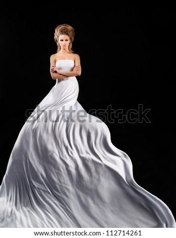 Pretty girl in fluttering white dress