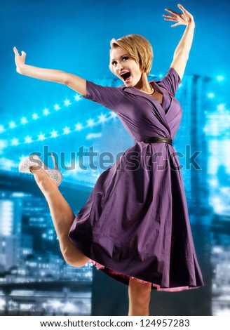 Active girl in a lilac dress