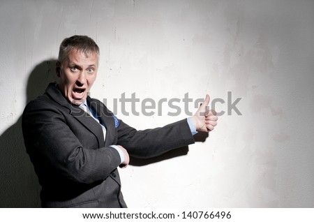 Portrait of angry businessman in a black suit