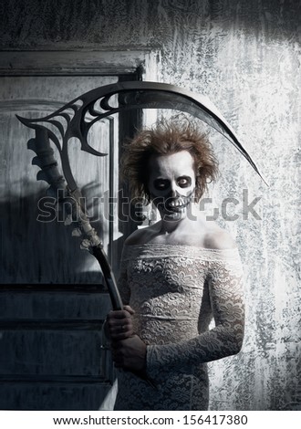 Scary ghost with a scythe in the old house