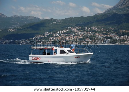 Taxi boat Loro,Herceg Novi,Montenegro:On a sunny day an attraction and transportation called Water Taxi Lacky takes people for tours on the zanjice beach ,August 03,2010,Herceg Novi,Montenegro