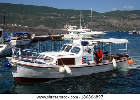 Taxi boat ,Herceg Novi,Montenegro:On a sunny day an attraction and transportation called Water Taxi  takes people for tours on the zanjice beach ,August 03,2010,Herceg Novi,Montenegro