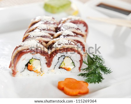 Sushi - Roll with Cucumber and Cream Cheese inside. Duck outside