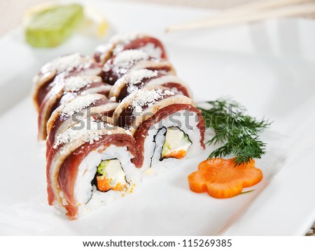 Sushi - Roll with Cucumber and Cream Cheese inside. Duck outside