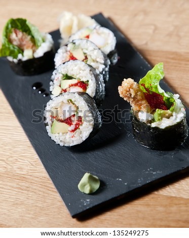 sushi. roll on a stone plate. asian cuisine