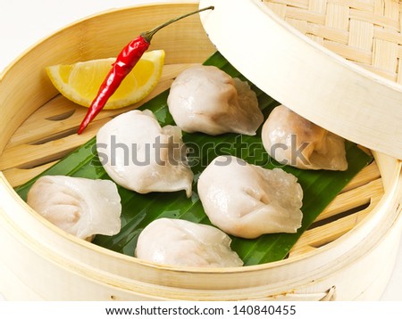 Dimsum Hagao in chinese bamboo basket. Gyoza. isolated on white. Dumplings