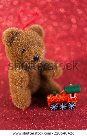cute bear. christmas decoration on red bright holiday background