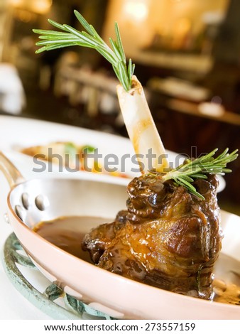 Caramelized Lamb knee in sauce in the pan
