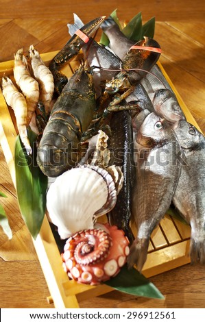 Fresh catch of fish and other seafood on wooden board