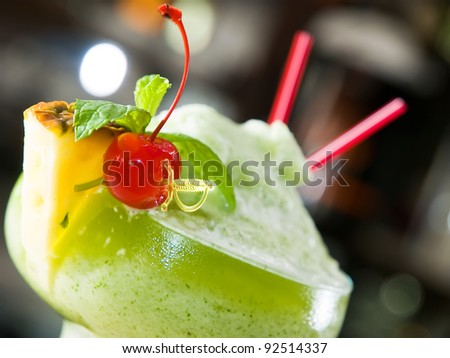 cocktail with pineapple and cherry