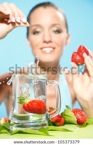 nice woman drop fruit into water