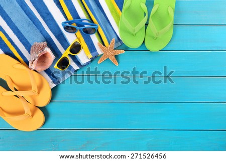 Summer sunbathing beach background, sunglasses, flip flops, copy space