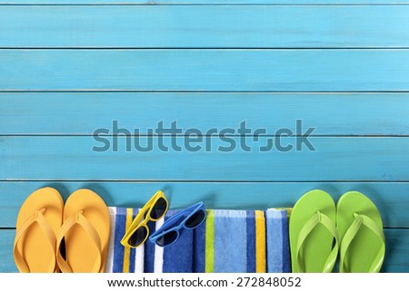 Summer beach background, blue deck, flip flops, copy space