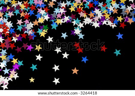 Starry night background; coloured stars scattered on a plain black background