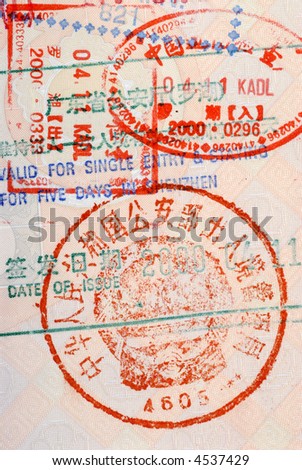 Chinese customs immigration travel stamp on the inside page of an Asian passport