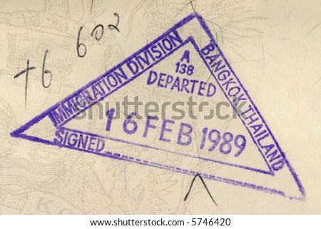 Thailand immigration stamp or travel permit on the inside page of an official identity document