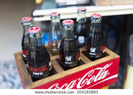 ALACATI, TURKEY -JULY 08, 2014:  Bottles of Coca Cola in a shop on the main kiosk selling refreshments.