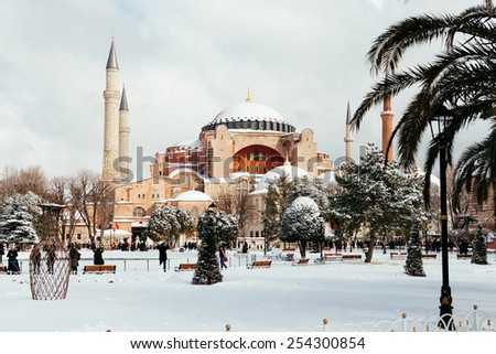 ISTANBUL, TURKEY - FEBRUARY 18, 2015:istanbul winter a day. St. Sophia Cathedral while snowing.People walking in Sultanahmet District under snow.