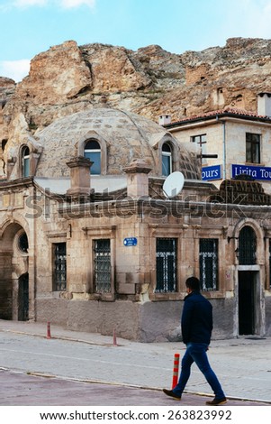 NEVSEHiR, TURKEY - MARCH 04, 2015:Old Turkish Hamamin Goreme city center.Desert landscape with ancient rock carved houses in Goreme turkish Kapadokya region in Asia Minor.