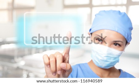 successful Young woman surgeon doctor making use of innovative technologies, she press touchscreen with empty button copy space, asian model