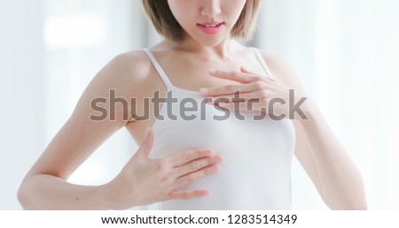 Similar – Image, Stock Photo Sick woman checking body temperature near window at home