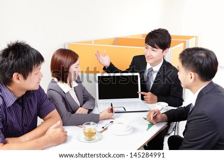 business people group meeting with finger point empty computer screen ( copy space ) at office, asian people