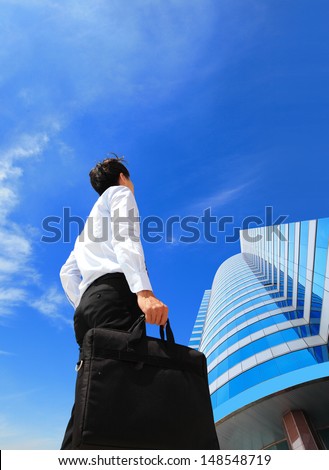 happy successful business man outdoors Next to Office Buildings with cityscape and sky in the background, asian people