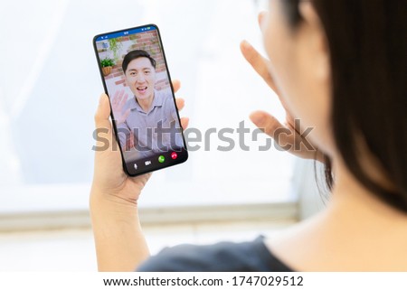 Similar – Image, Stock Photo Cheerful woman having video call