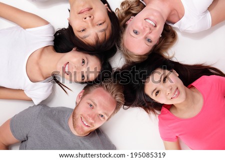 Happy Group of friends lying and making a circle, asian and caucasian